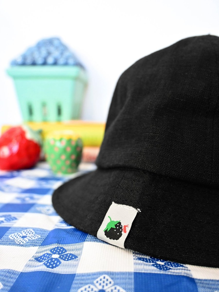 "Blackberry & Ant" Linen bucket hat. Designed by HO HOS HOLE IN THE WALL brand. Made in NYC.